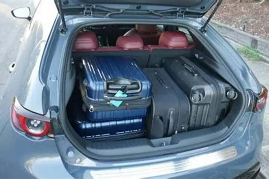 stroller fitting inside Mazda 3 trunk with seats folded and hatch open