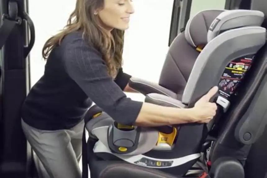 High-back booster seat secured with LATCH connectors in vehicle back seat